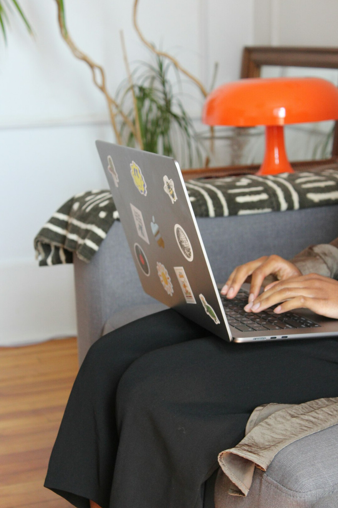 person coding on laptop at home