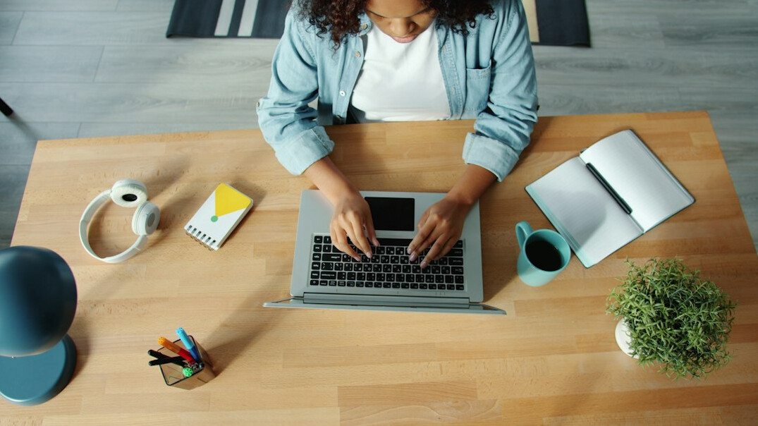 person working on laptop at home