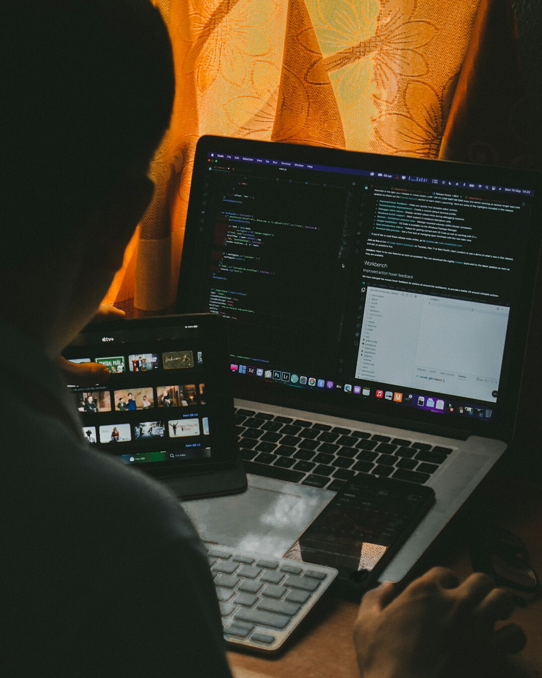 person coding at home desk