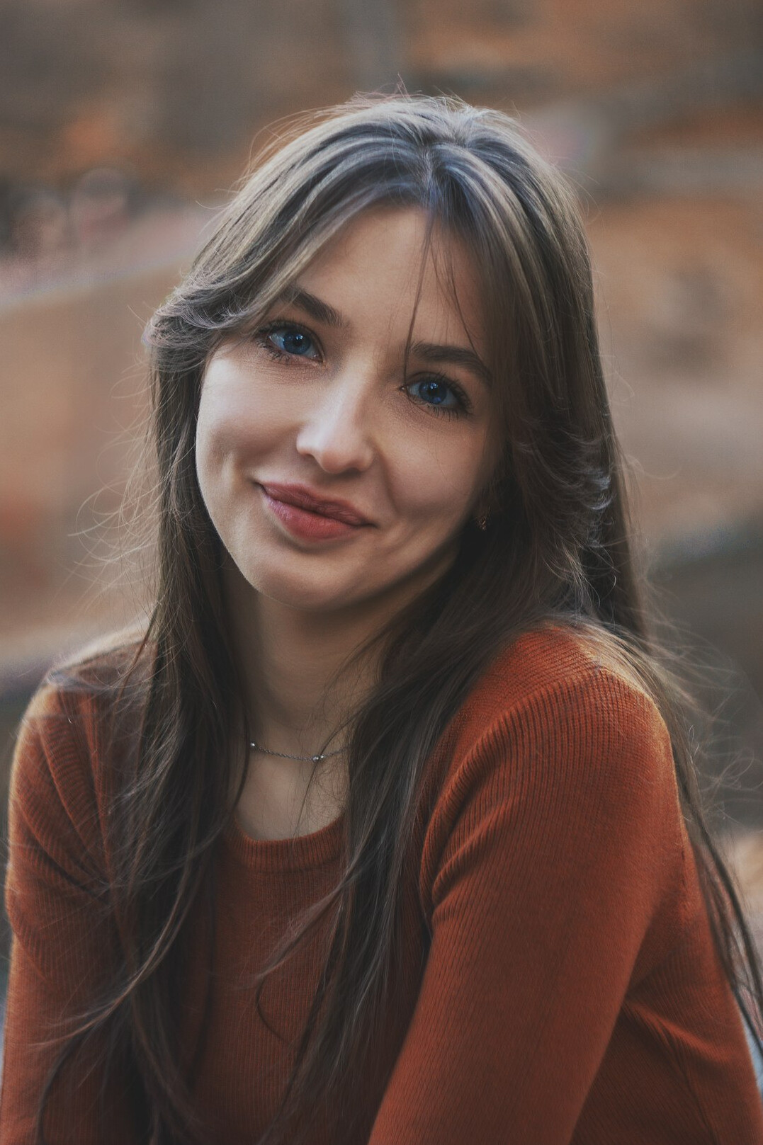 Portrait of a smiling woman with long brown hair