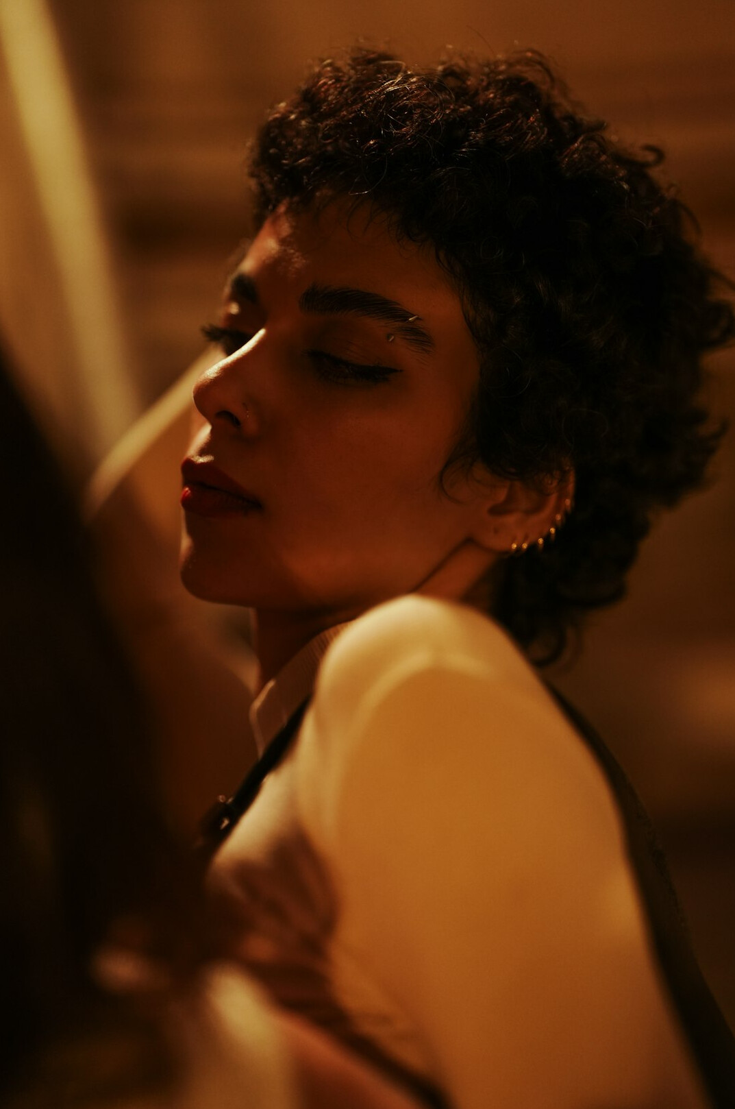 Portrait of a woman with short curly hair
