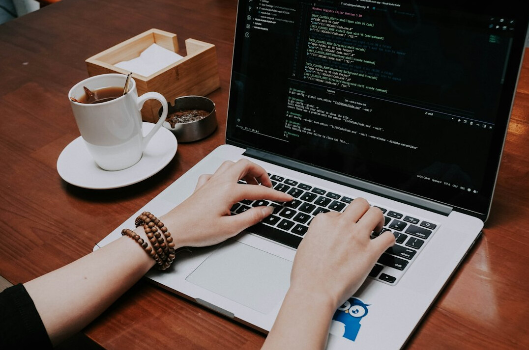 person learning coding on laptop